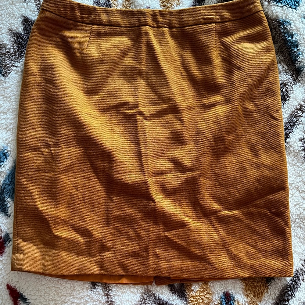 A line above the knee or just below skirt.